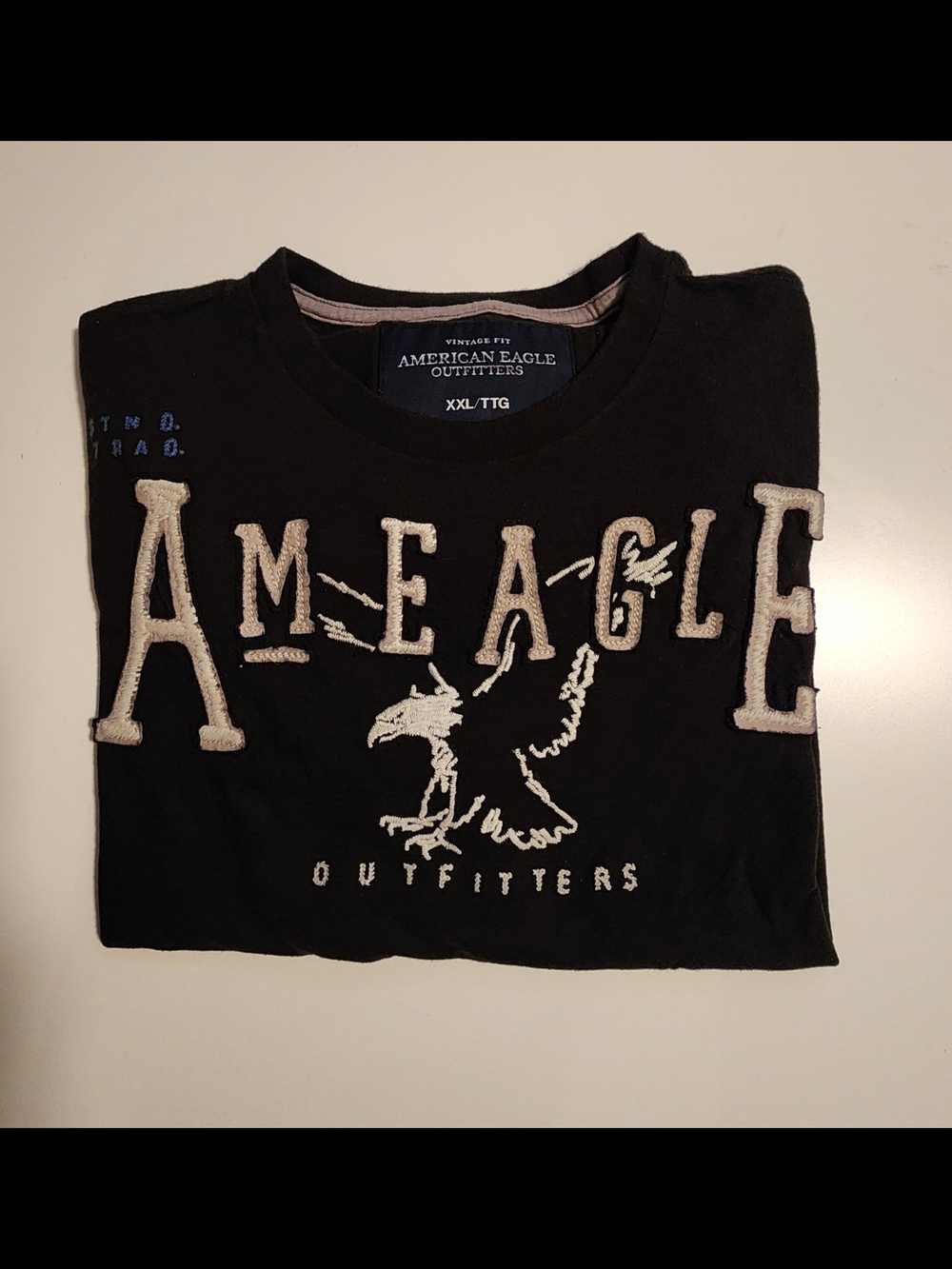 Vintage American Eagle Outfitters Black Tee with Cream Logo Appliqué